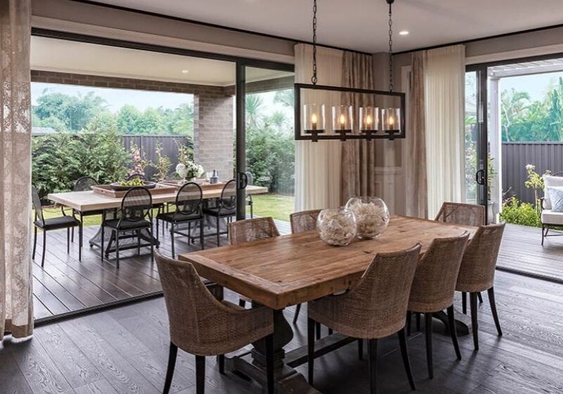 image of indoor and outdoor living areas featuring dark engineered timber flooring vs hybrid